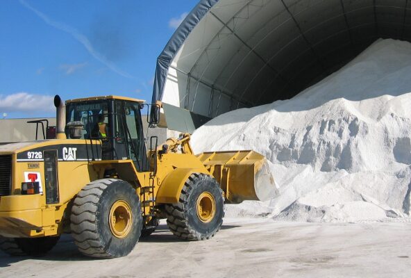 Loader working a pile of material in the supply yard